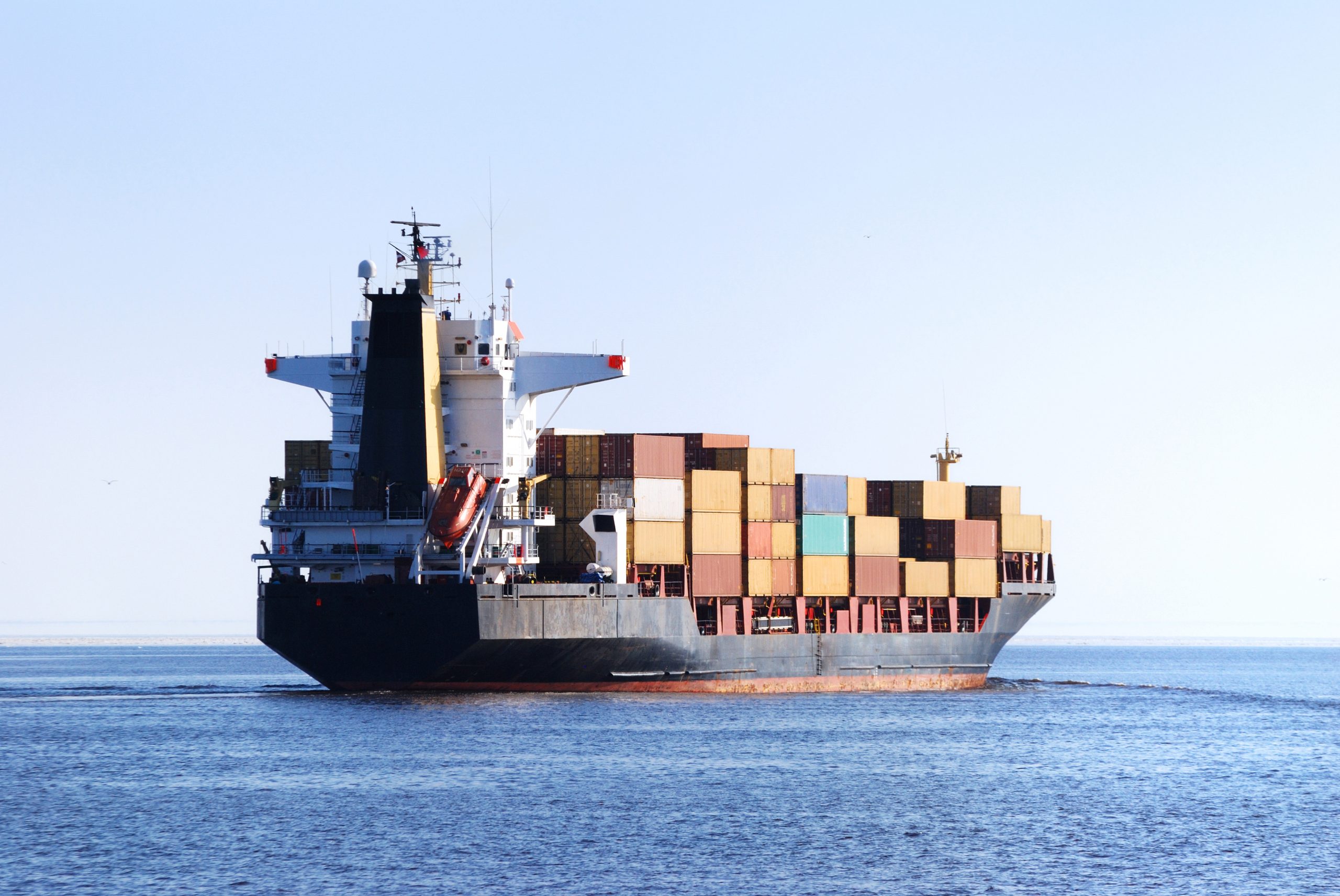 Cargo,Ship,Sailing,In,Still,Water